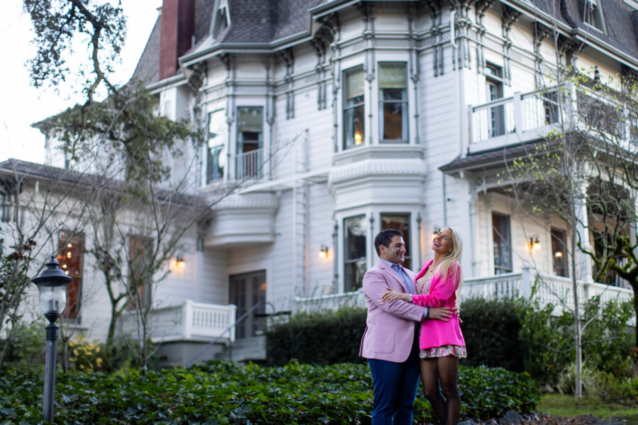 in front of the iconic madrona manor hotel after getting engaged